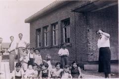 Photo Henry Blumenstein with group of kids 