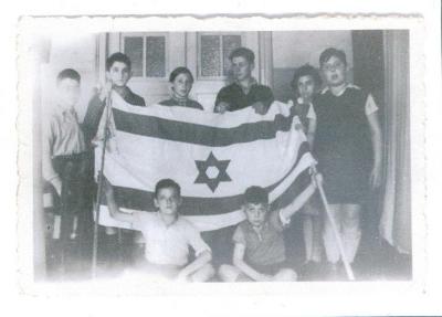 Photo Young Werner and others with the flag of Israel 