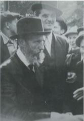 Rabbi Elizer Silver Standing, Surrounded by Young Boys