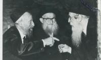 Picture of Rabbi Eliezer Silver in animated conversation with two other Rabbis