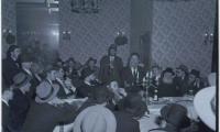 Picture of Rabbi Eliezer Silver Speaking at a Unidentified Wedding, Surrounded by Unidentified Rabbanim
