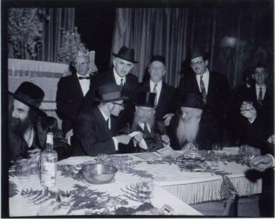 Rabbi Eliezer Silver Making a Kinyan (Acquisition) with a Chassan (Groom) while serving as Misader Kiddushin (Officiating Rabbi) at an Unidentified Wedding