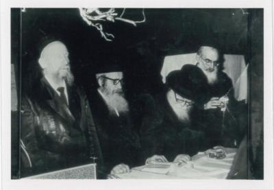 Rabbi Eliezer Silver Standing and Davening with a Group of Unidentified Rabbanim